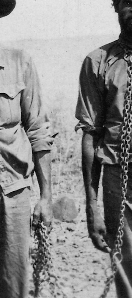 Men with Aboriginal prisoner in chains